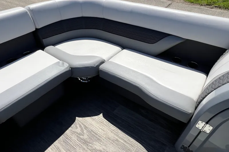 Slide: The Image of Luxurious seating on 2023 Godfrey Monaco 235 SB pontoon boat, featuring sleek gray upholstery. - 21
