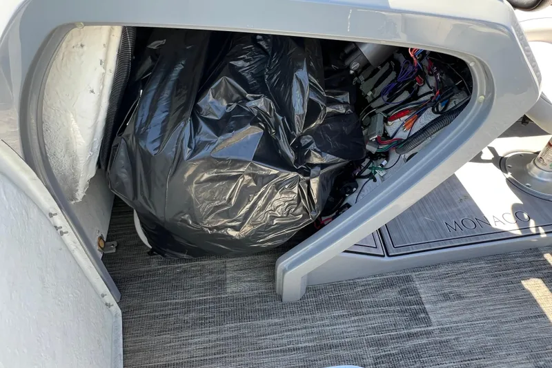 Slide: The Image of Storage compartment of 2023 Godfrey Monaco 235 SB boat with wiring and equipment. - 22