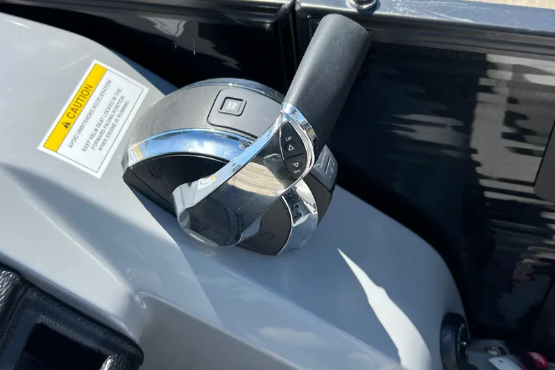 Slide: The Image of Close-up of throttle control on 2023 Godfrey Monaco 235 SB boat. - 27