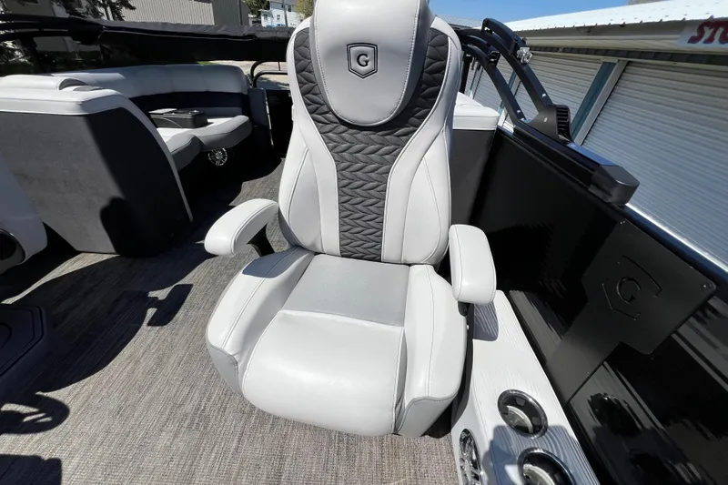Slide: The Image of Luxurious seating on 2023 Godfrey Monaco 235 SB pontoon boat, featuring sleek design and comfort. - 31