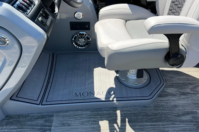 Slide: The Image of Captain's chair and controls on 2023 Godfrey Monaco 235 SB boat. - 33