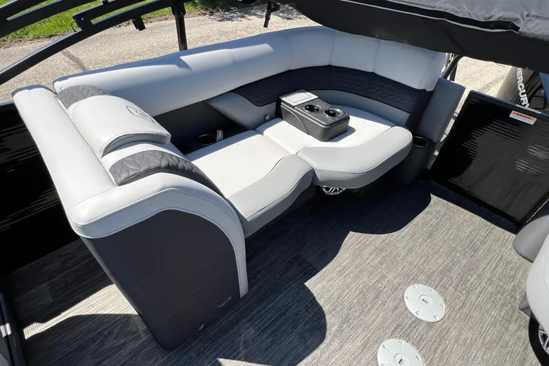 Slide: The Image of Luxurious seating area on 2023 Godfrey Monaco 235 SB pontoon boat with cup holders. - 34