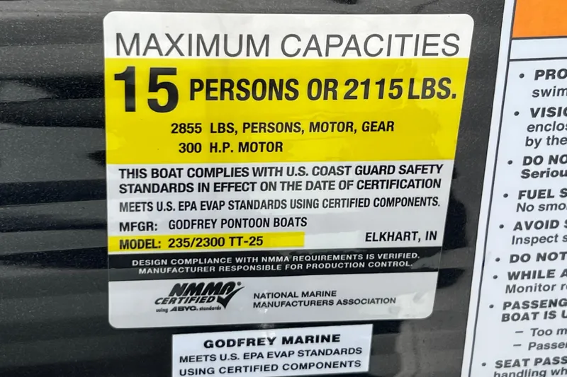 Slide: The Image of 2023 Godfrey Monaco 235 SB capacity label: 15 persons or 2115 lbs, 300 HP motor. - 35