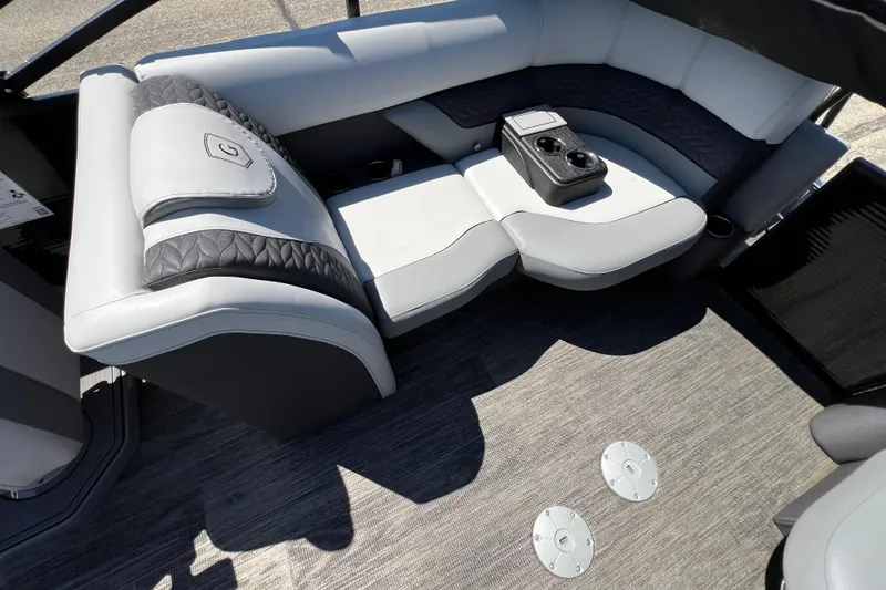 Slide: The Image of Luxurious seating area on 2023 Godfrey Monaco 235 SB pontoon boat with cup holders. - 37