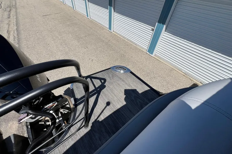 Slide: The Image of 2023 Godfrey Monaco 235 SB boat deck with storage units in background. - 38