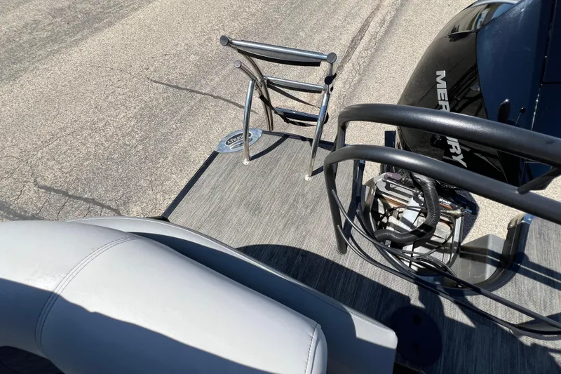 Slide: The Image of 2023 Godfrey Monaco 235 SB boat deck with Mercury engine and ladder. - 40