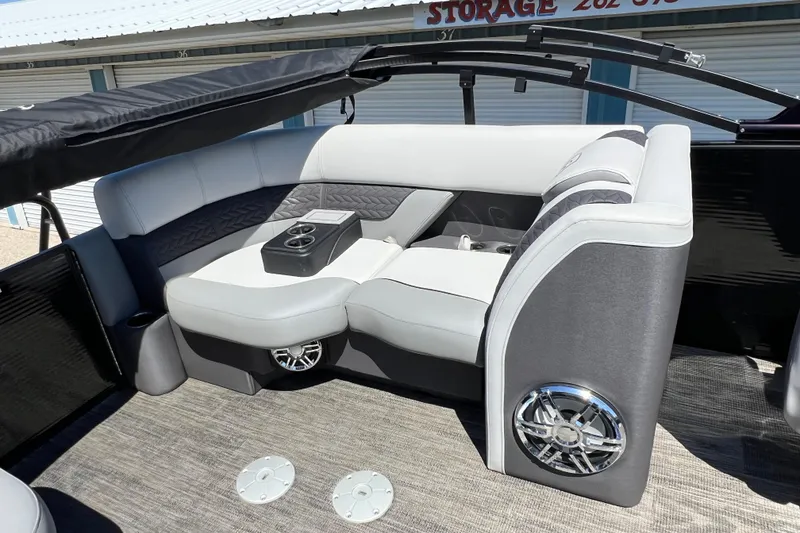 Slide: The Image of Luxurious seating area on 2023 Godfrey Monaco 235 SB pontoon boat with cup holders. - 41