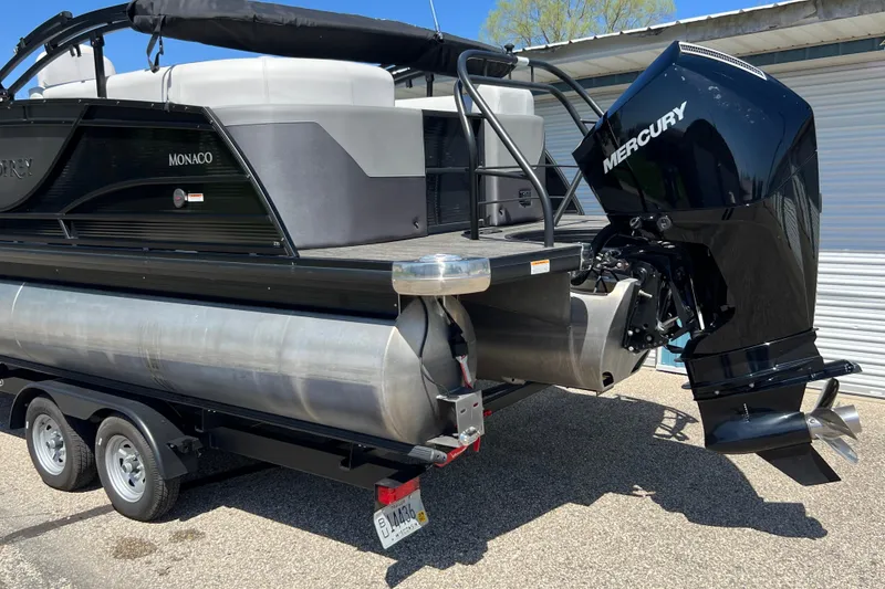Slide: The Image of 2023 Godfrey Monaco 235 SB pontoon boat with Mercury outboard motor on trailer. - 42