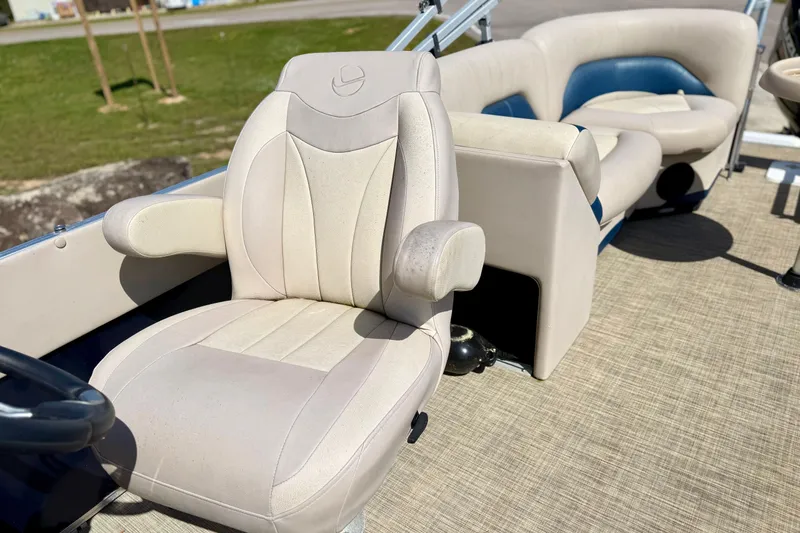 Slide: The Image of 2015 Landau Signature 2500 Cruise boat interior with beige and blue seating. - 11