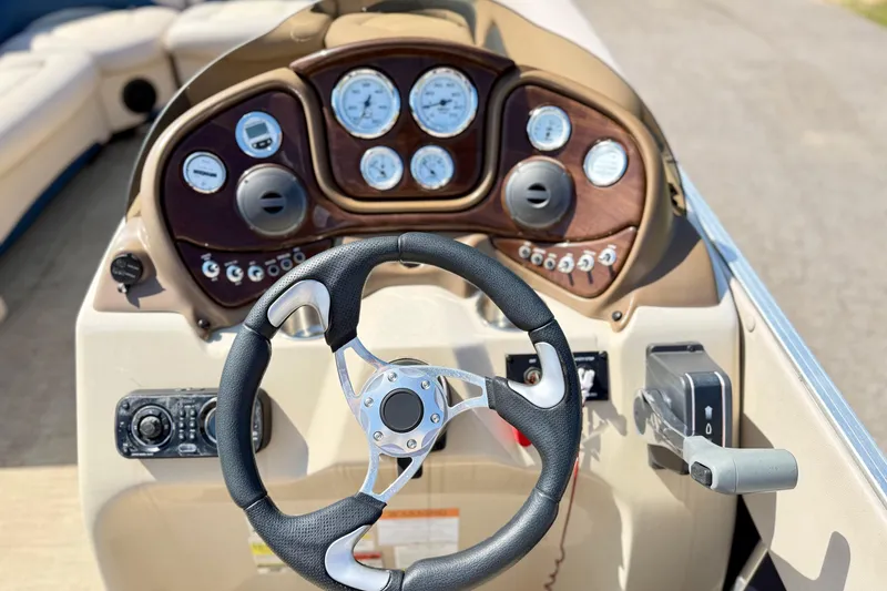 Slide: The Image of Steering console of 2015 Landau Signature 2500 Cruise boat with gauges and controls. - 12