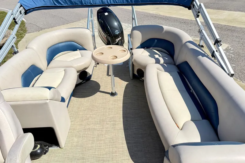 Slide: The Image of 2015 Landau Signature 2500 Cruise pontoon boat with spacious seating and table. - 17