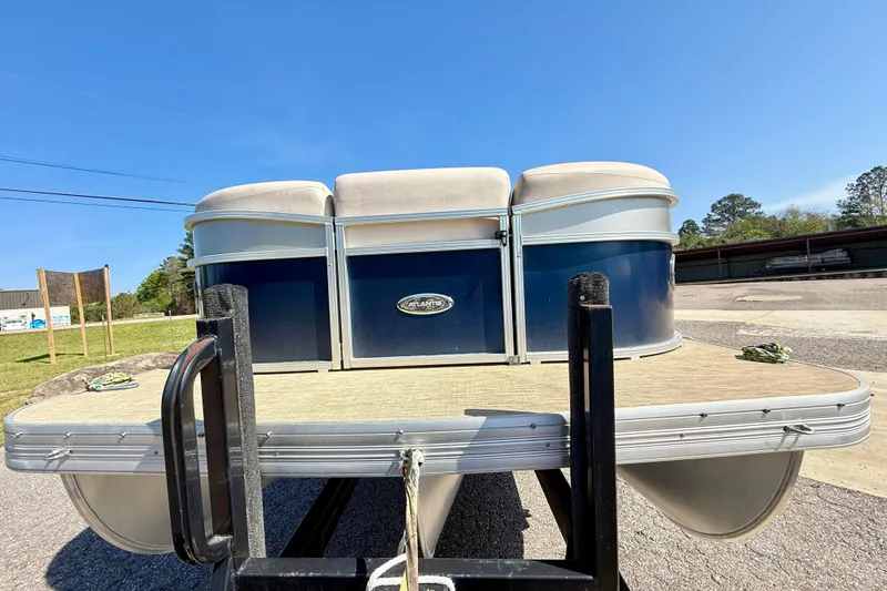 Slide: The Image of 2015 Landau Signature 2500 Cruise pontoon boat on trailer, sunny day, outdoor setting. - 8