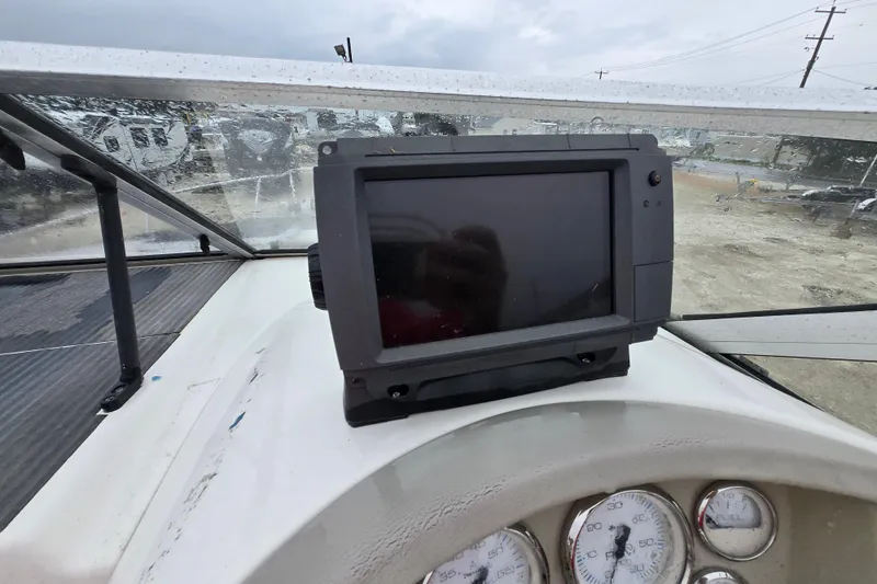 Slide: The Image of Dashboard of a 1996 Wellcraft 26 Exel SE boat with navigation equipment. - 13