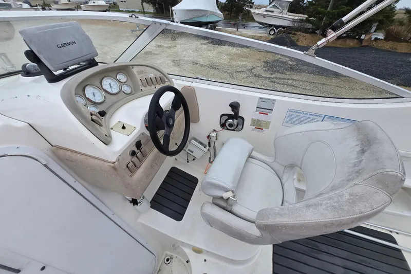 Slide: The Image of Cockpit of 1996 Wellcraft 26 Exel SE boat with steering wheel and Garmin GPS. - 7