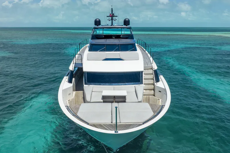 Slide: The Image of Sanlorenzo SL96A 2021 yacht cruising on clear turquoise waters under a blue sky. - 13
