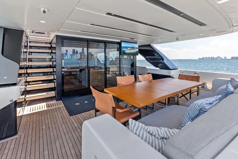 Slide: The Image of Luxurious 2021 Sanlorenzo SL96A yacht deck with dining area and ocean view. - 18