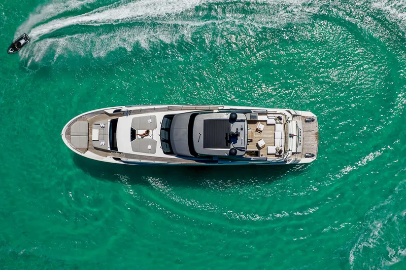 Slide: The Image of Aerial view of 2021 Sanlorenzo SL96A yacht cruising in turquoise waters. - 3