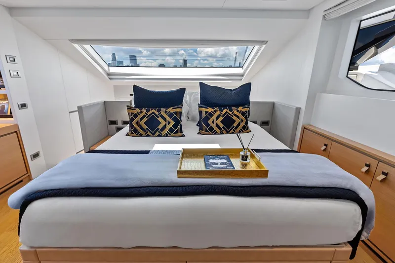 Slide: The Image of Luxurious bedroom interior of 2021 Sanlorenzo SL96A yacht with elegant decor and skylight. - 30