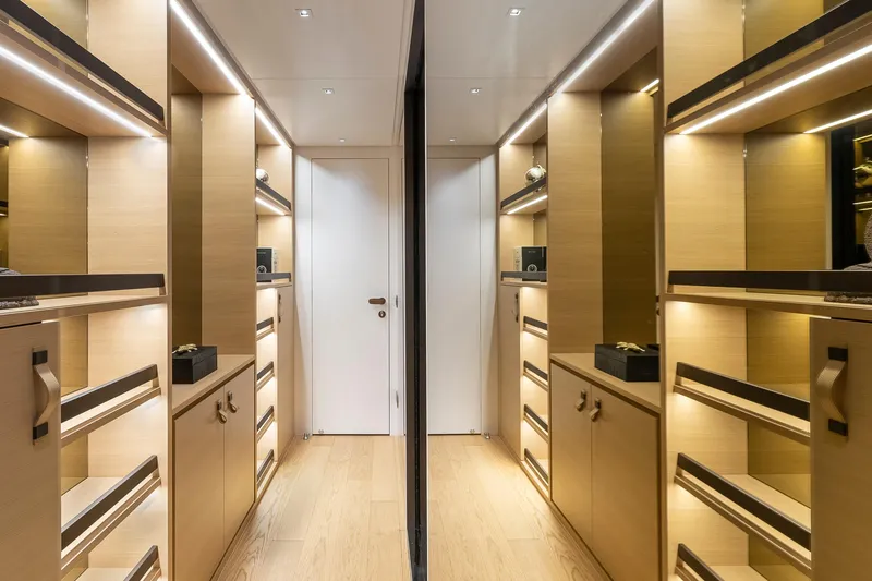 Slide: The Image of Luxurious wooden interior of 2021 Sanlorenzo SL96A yacht with elegant cabinetry and ambient lighting. - 36