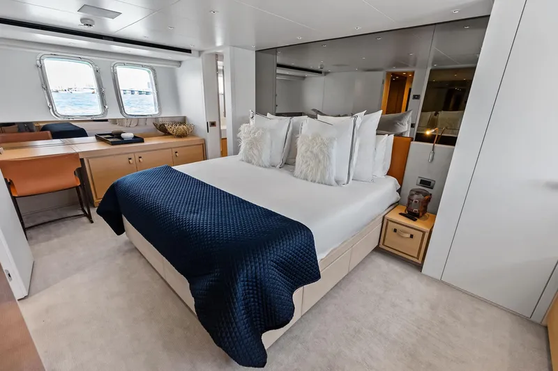 Slide: The Image of Luxurious 2021 Sanlorenzo SL96A yacht bedroom with elegant decor and ocean view. - 39