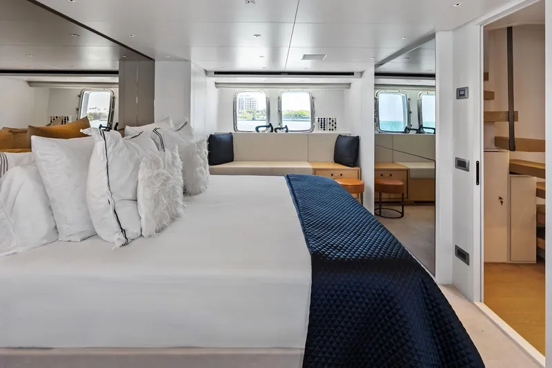 Slide: The Image of Luxurious interior of 2021 Sanlorenzo SL96A yacht with elegant bedding and seating area. - 41