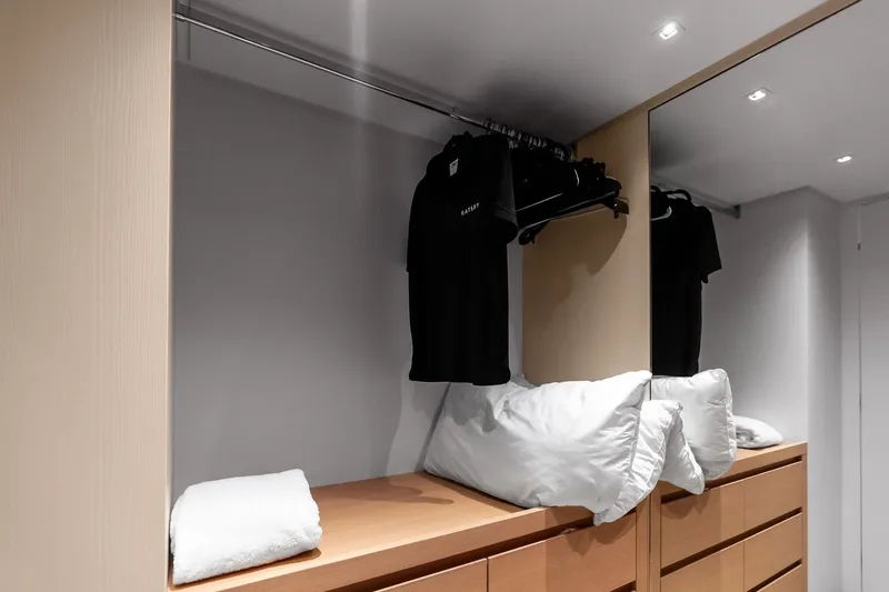 Slide: The Image of Modern closet interior on 2021 Sanlorenzo SL96A yacht with clothes and pillows. - 44