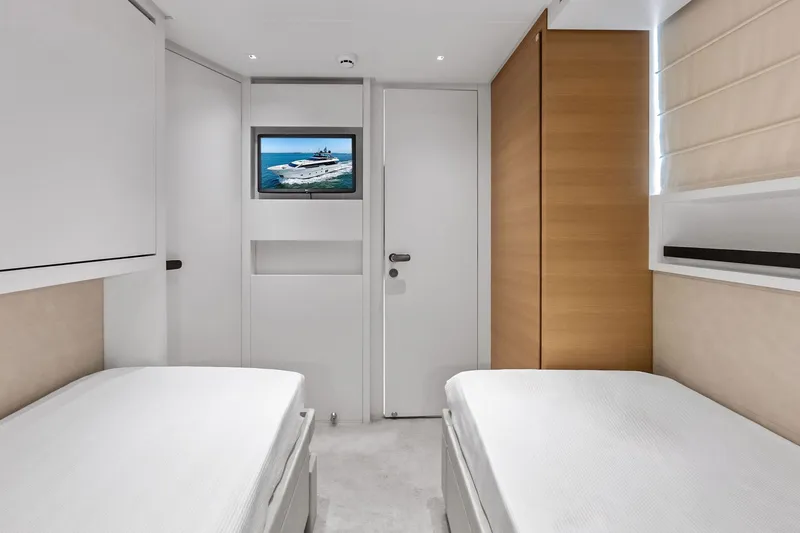 Slide: The Image of Interior of 2021 Sanlorenzo SL96A yacht with twin beds and wall-mounted TV. - 52