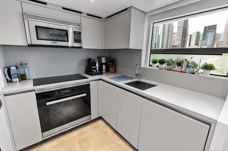 Slide: The Image of Modern kitchen interior on 2021 Sanlorenzo SL96A yacht with cityscape view. - 54