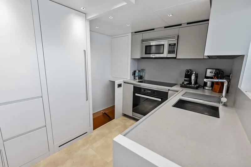 Slide: The Image of Modern kitchen in 2021 Sanlorenzo SL96A yacht with sleek appliances and minimalist design. - 55