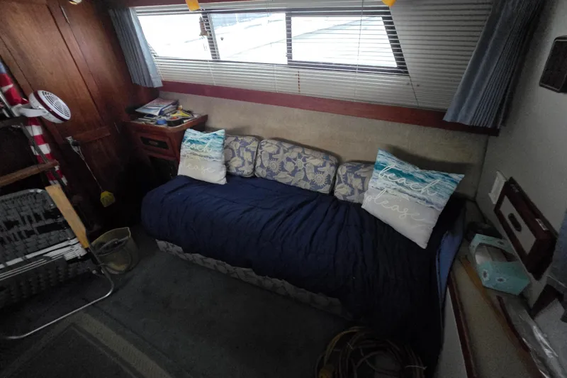 Slide: The Image of Interior of 1987 Carver 32 Mariner with cozy seating and nautical decor. - 6