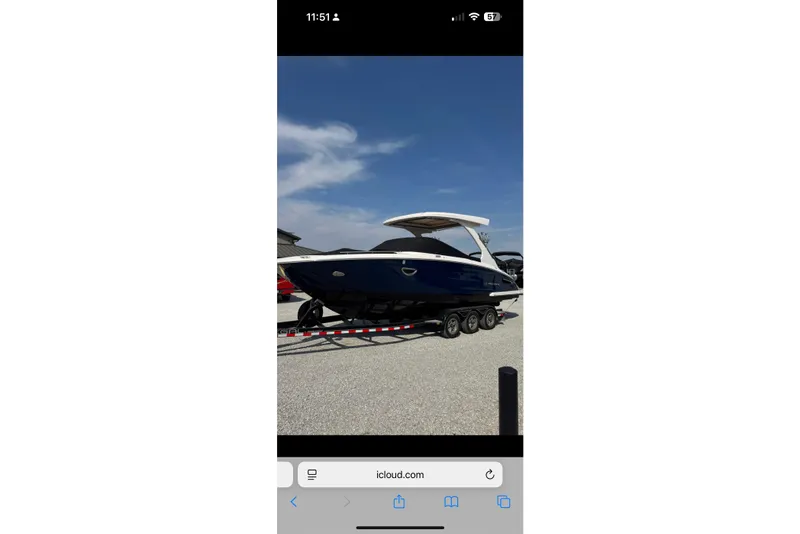 The Image of 2020 Regal 2800 Bowrider boat on trailer under clear blue sky. - 1