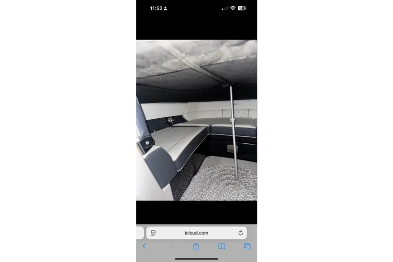 Slide: The Image of Interior view of a 2020 Regal 2800 Bowrider boat cabin with seating and carpet. - 5