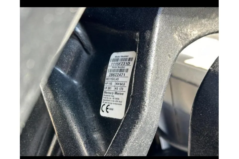 Slide: The Image of 2019 Bayliner Element F18 boat console with storage compartment and rod holders. - 10