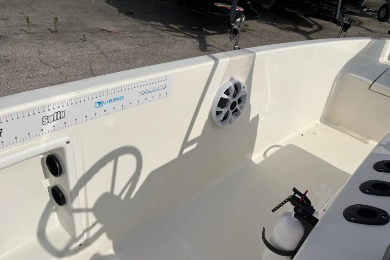 Slide: The Image of 2019 Bayliner Element F18 boat interior with speaker and fishing rod holders. - 26