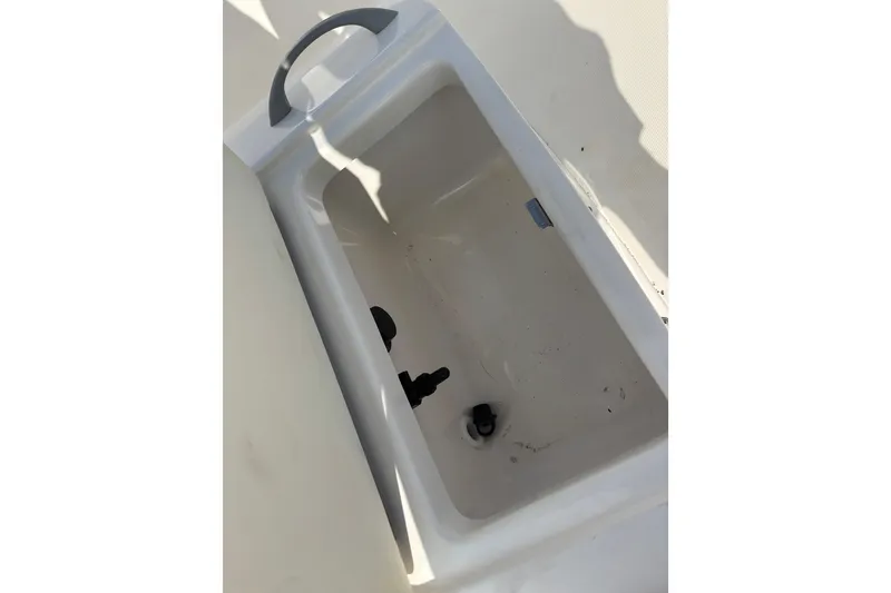 Slide: The Image of 2019 Bayliner Element F18 boat storage compartment, open and empty. - 29