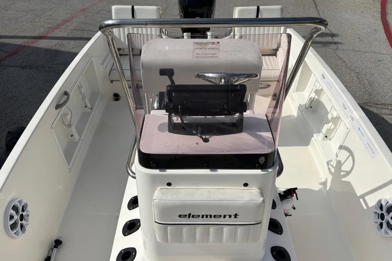 Slide: The Image of 2019 Bayliner Element F18 boat interior with steering console and seating. - 31