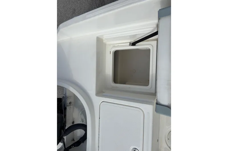 Slide: The Image of 2019 Bayliner Element F18 boat storage compartment, open and empty. - 35