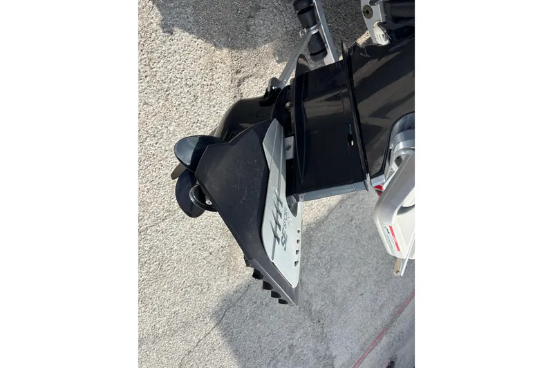 Slide: The Image of 2019 Bayliner Element F18 boat motor and propeller close-up on concrete surface. - 38