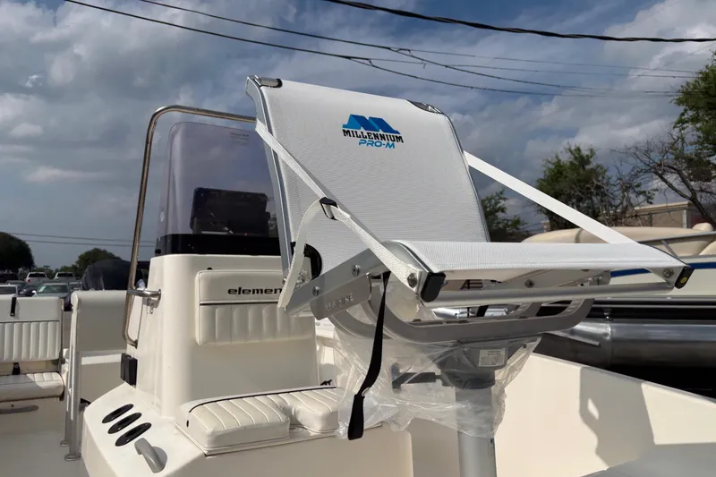 Slide: The Image of 2019 Bayliner Element F18 boat with Millennium Pro-M seat under cloudy sky. - 41