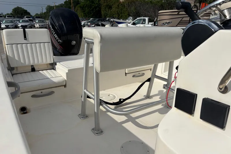Slide: The Image of 2019 Bayliner Element F18 boat interior with seating and Mercury engine. - 42