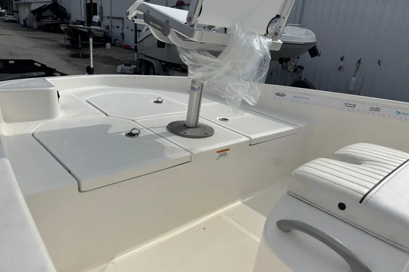 Slide: The Image of 2019 Bayliner Element F18 boat interior with seating and storage compartments. - 46