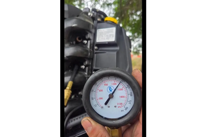 Slide: The Image of Pressure gauge on a 2019 Bayliner Element F18 boat engine. - 51