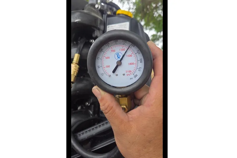 Slide: The Image of Pressure gauge on a 2019 Bayliner Element F18 boat engine. - 52
