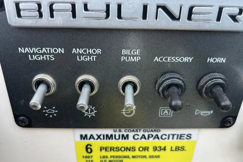 Slide: The Image of 2019 Bayliner Element F18 boat on trailer, parked outdoors. - 6