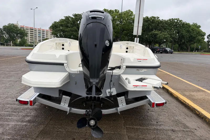 Slide: The Image of 2019 Bayliner Element F18 boat on trailer, rear view with outboard motor. - 62
