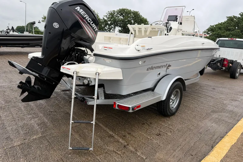 Slide: The Image of 2019 Bayliner Element F18 boat on trailer with Mercury outboard motor. - 64