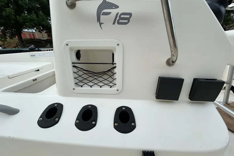 Slide: The Image of 2019 Bayliner Element F18 boat dashboard with steering wheel and navigation system. - 7