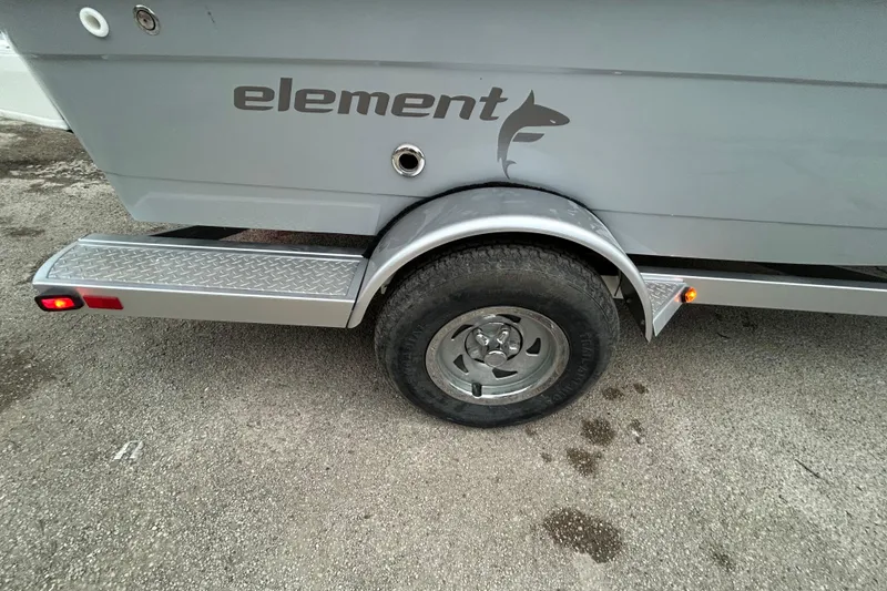 Slide: The Image of 2019 Bayliner Element F18 boat detail with storage compartment and logo. - 8