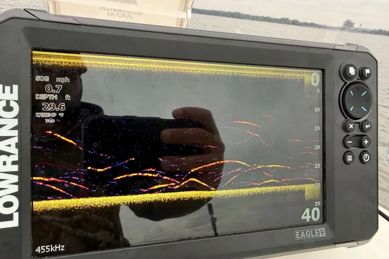 Slide: The Image of Lowrance fish finder display on 2019 Bayliner Element F18 boat, showing depth and speed. - 80
