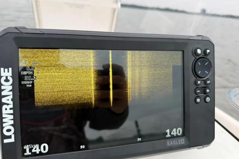 Slide: The Image of Lowrance fishfinder display on 2019 Bayliner Element F18 boat, showing sonar data. - 81